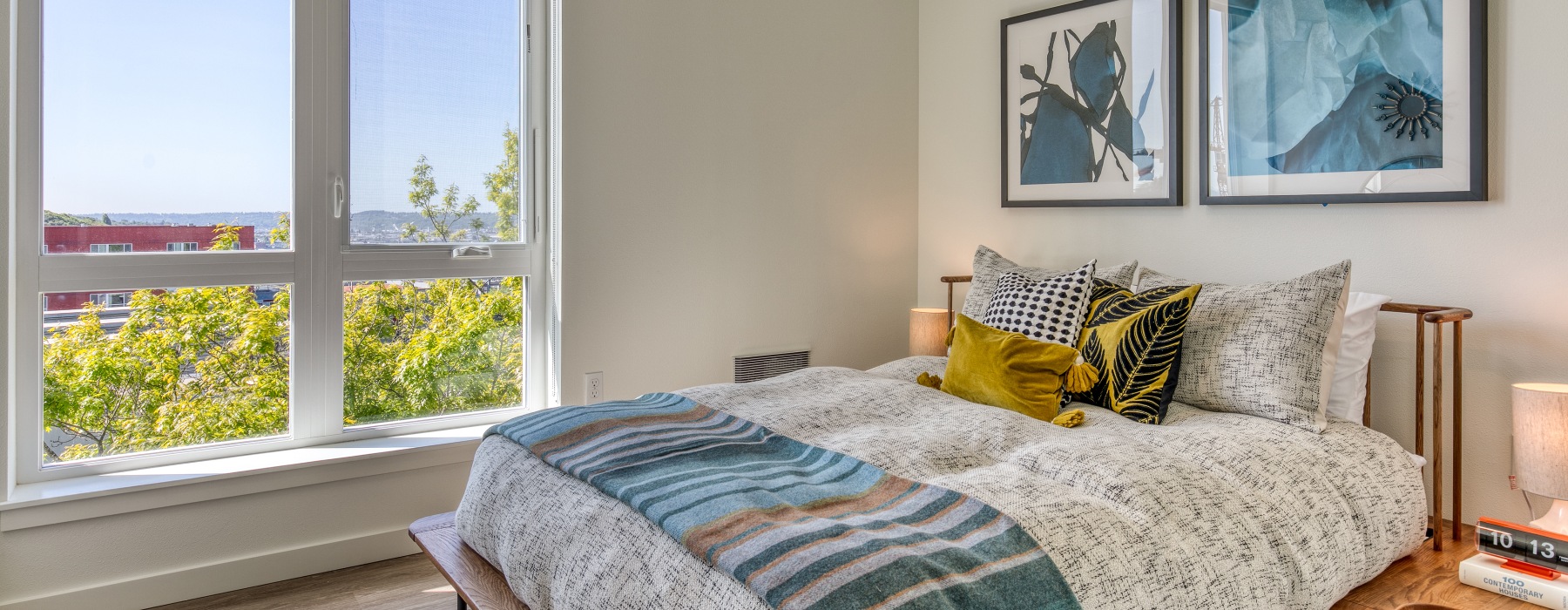 bed by large windows