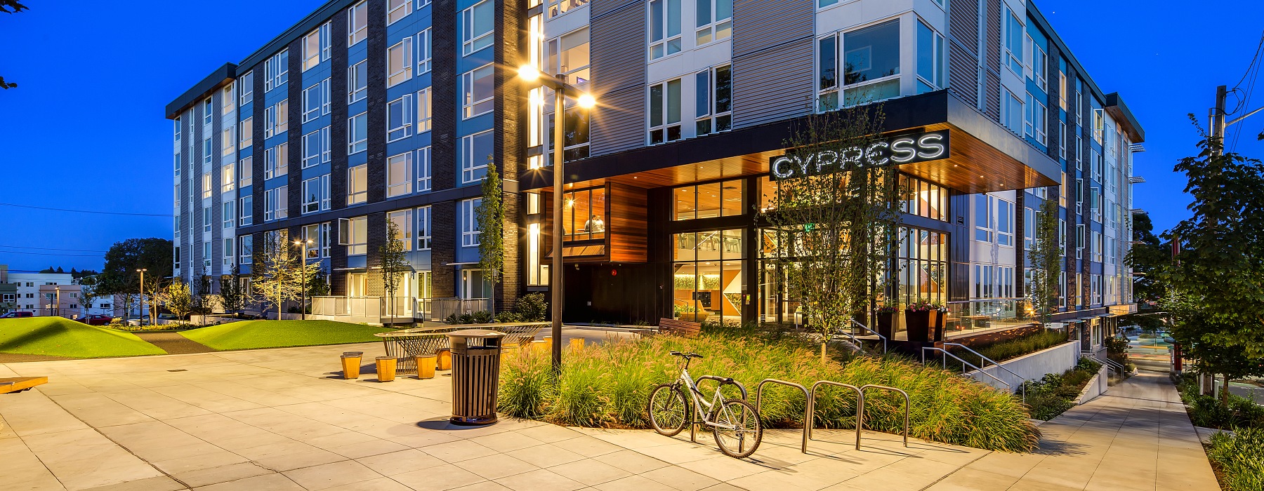 Cypress apartment building lit at night